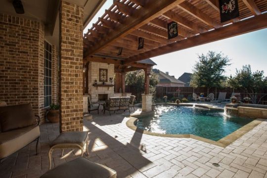 outdoor swimming pool and pergola