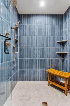 shower room with blue tiles