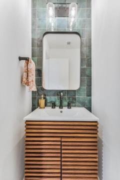 powder room with wood vanity