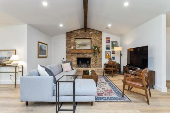 living room with brick wall fireplaces