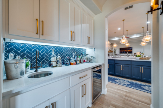 wet bar with blue pattern backsplash