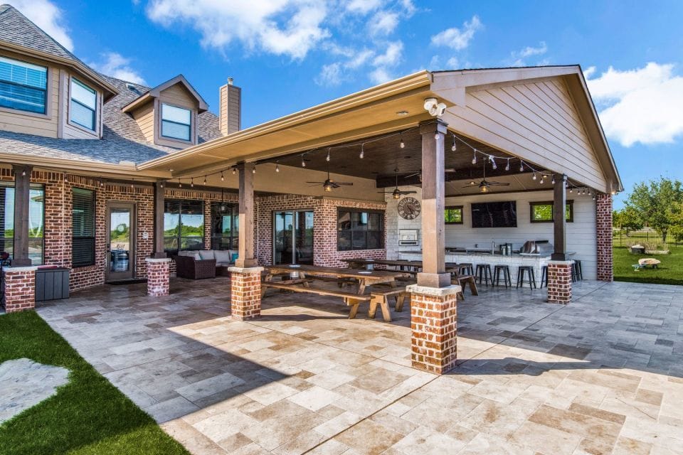 create an outdoor living room with a patio cover or pergola